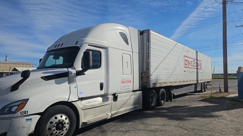 One2One Transport truck on the road